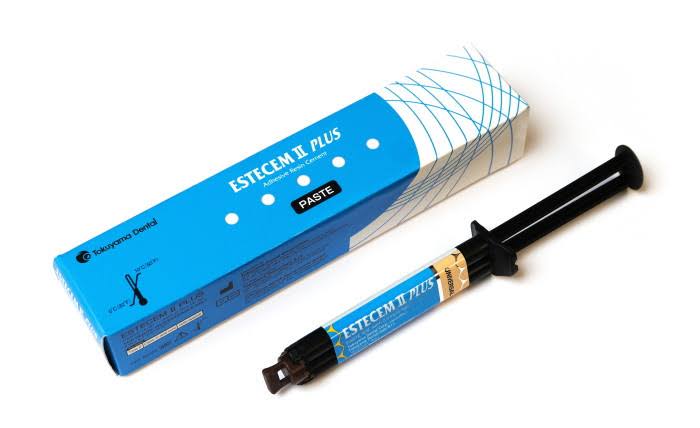Tokuyama EsteCem II Plus self adhesive resin cement in a syringe with packaging for dental use