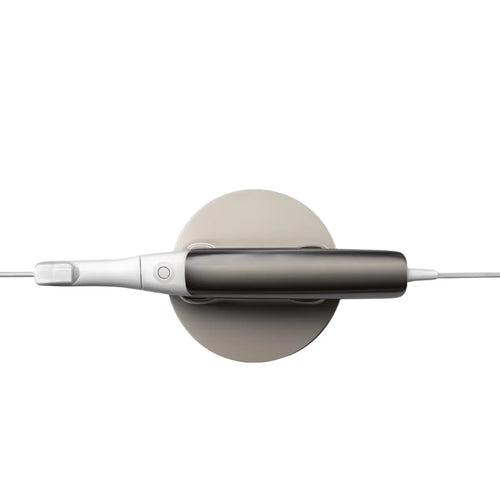 Beetle Dental 3Shape Trios 3 intraoral scanner top view handheld wand on round charging dock white gray
