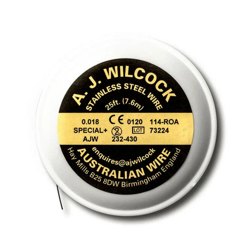 A J Wilcock stainless steel dental wire spool 25ft white reel with black and yellow label showing 018 size