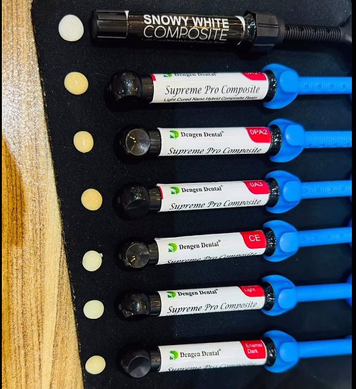 Set of Dengen Supreme Pro Composite resin syringes in shade samples with blue dispensers for dental restorations