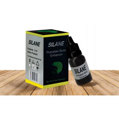 Dengen Silane dental bonding agent bottle and box porcelain bond enhancer on wooden table by Beetle Dental