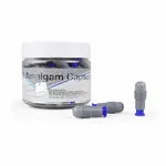 Beetle Dental dental amalgam capsules in a clear jar with two loose capsules beside it