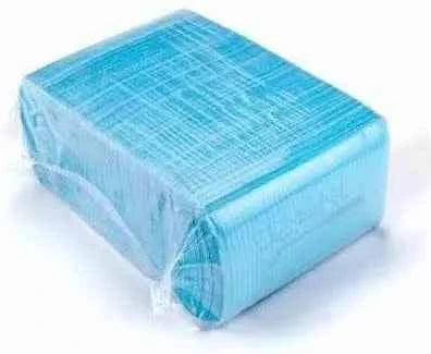 Pack of blue dental patient bibs by Beetle Dental with textured surface for splash protection