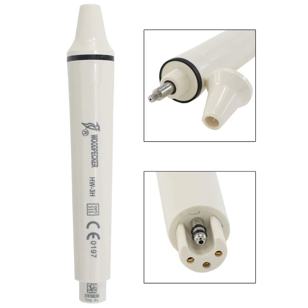 White Woodpecker ultrasonic scaler handpiece close up showing connector pins and removable tip for dental cleaning