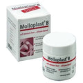 Detax Mollosol B dental material soft denture liner in a container with product packaging