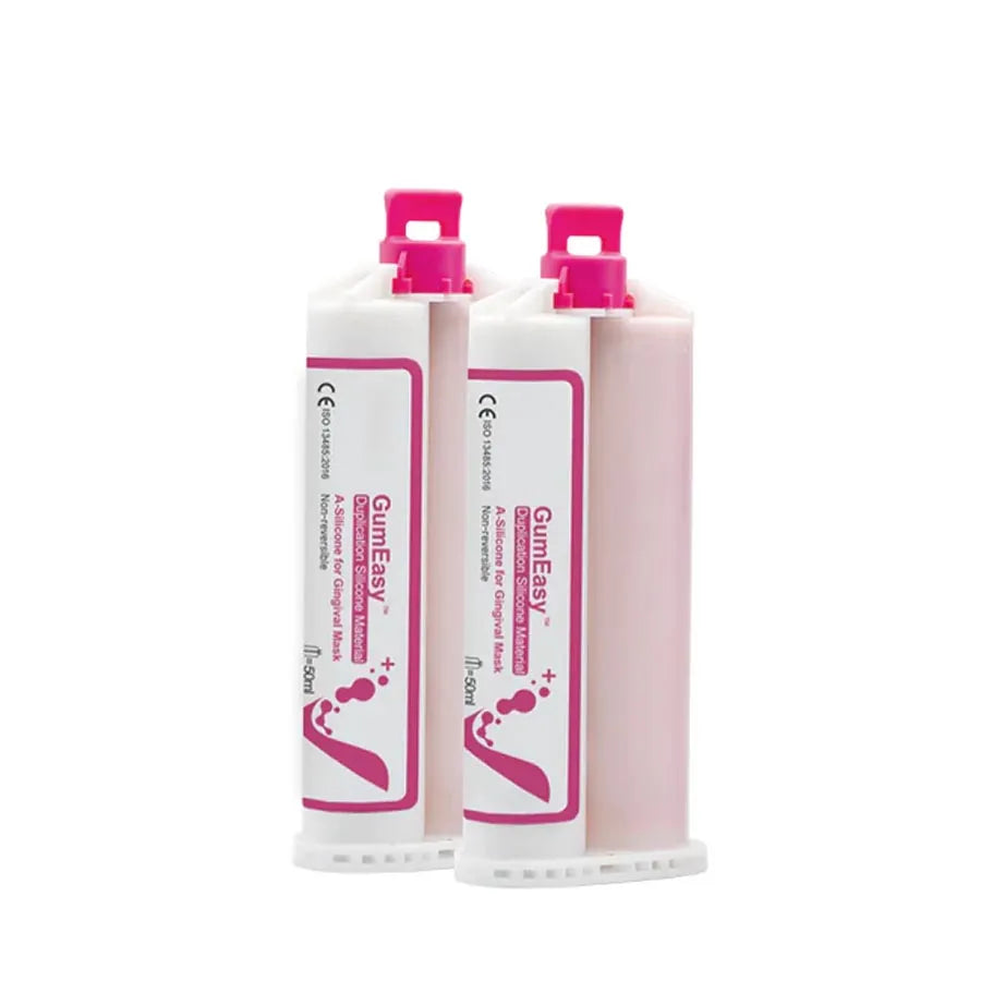 Two pink cartridges of Beetle Dental A-silicone gingival mask material with dispensing caps for dental impressions