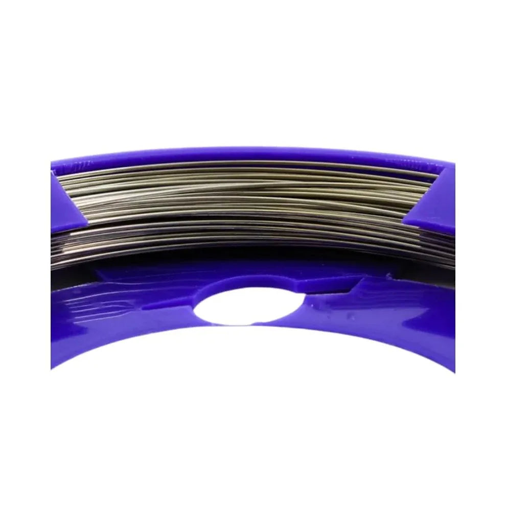 Orthodontic stainless steel wire roll on a purple spool for dental applications
