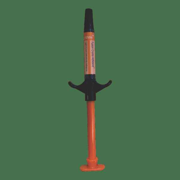 Prevest Fusion Crysta adhesive syringe in orange and black for dental applications