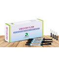 Dengen VIBGYOR Flow dental composite box with four syringes and dispensing tips on wooden surface