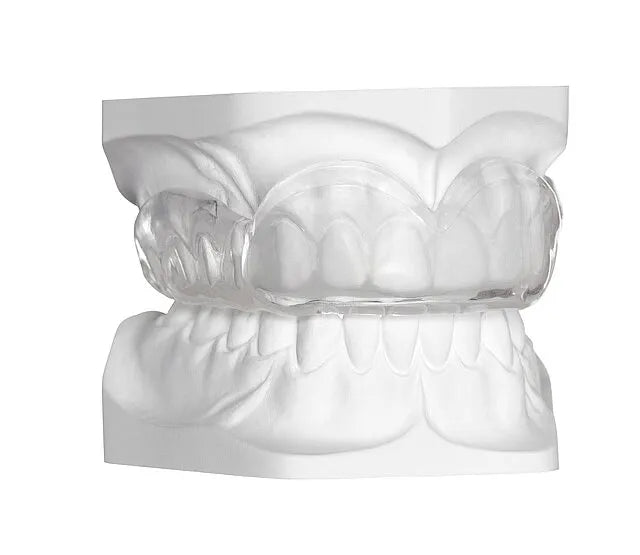 Clear occlusal splint on white dental model showing fit and relief Scheu Duran dental insulation foil