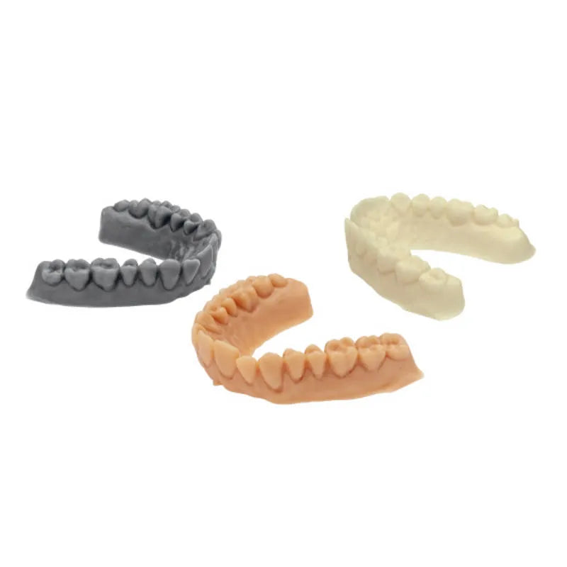 Three 3D printed dental lower arch models in gray beige and ivory using Scheu Imprimo LC dental 3D printing resin