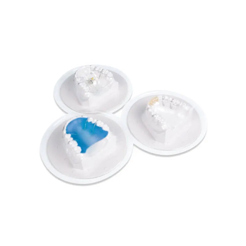 Three dental stone models in round trays showing blue palatal lining with Scheu transparent coating foil