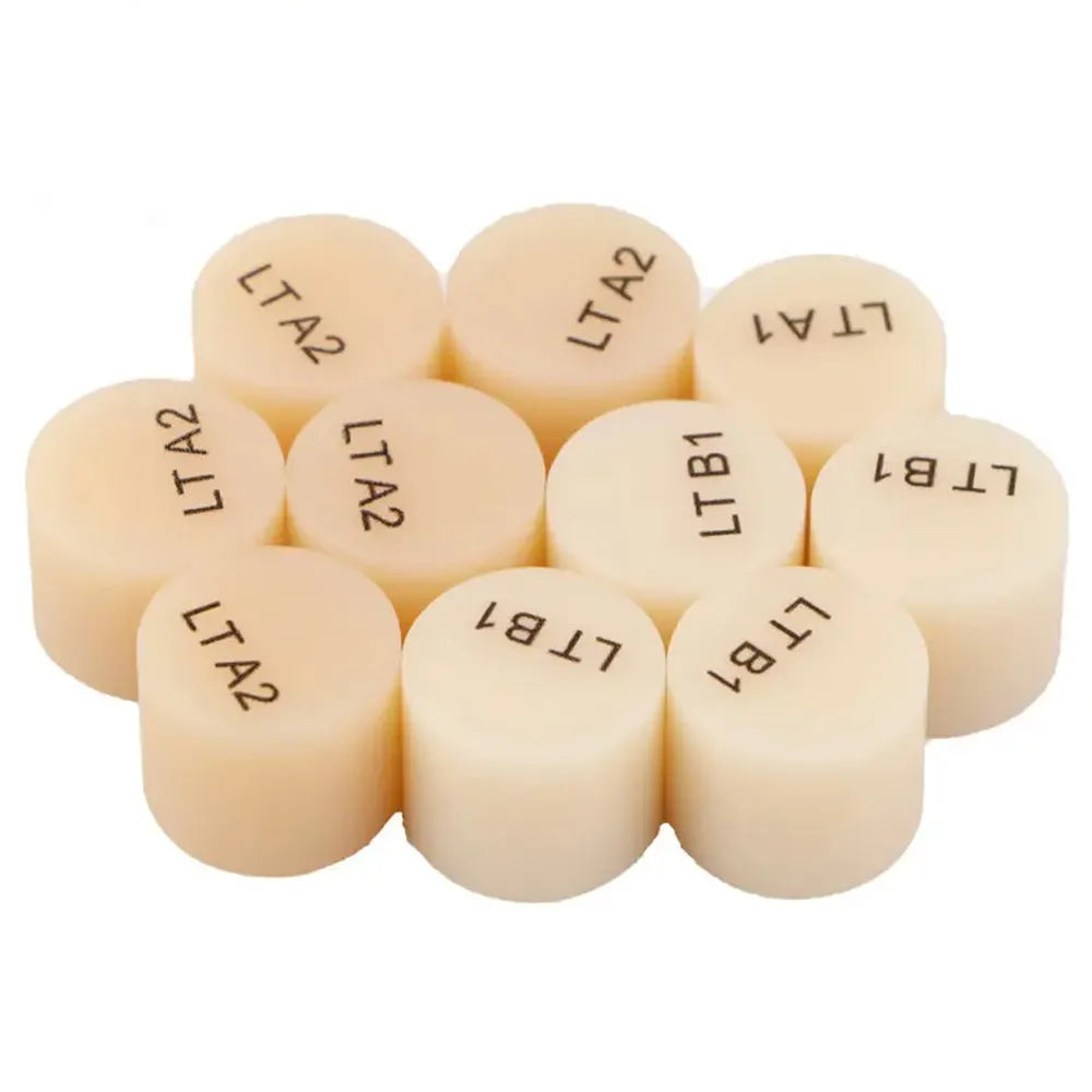 Collection of Upcera UP Press lithium disilicate ingots in various shades for dental restorations