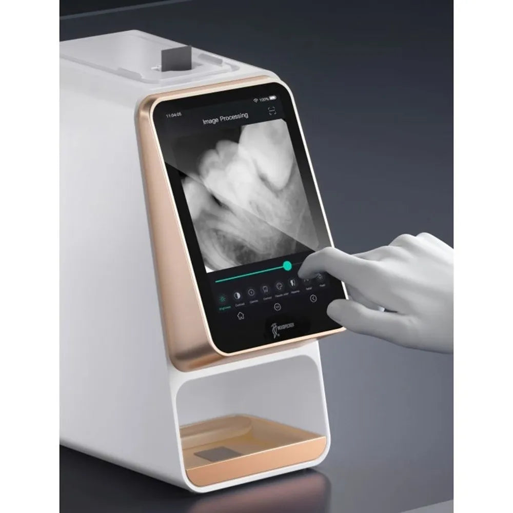 Beetle Dental Woodpecker i-Scan dental scanner touchscreen showing dental X ray image with gloved hand