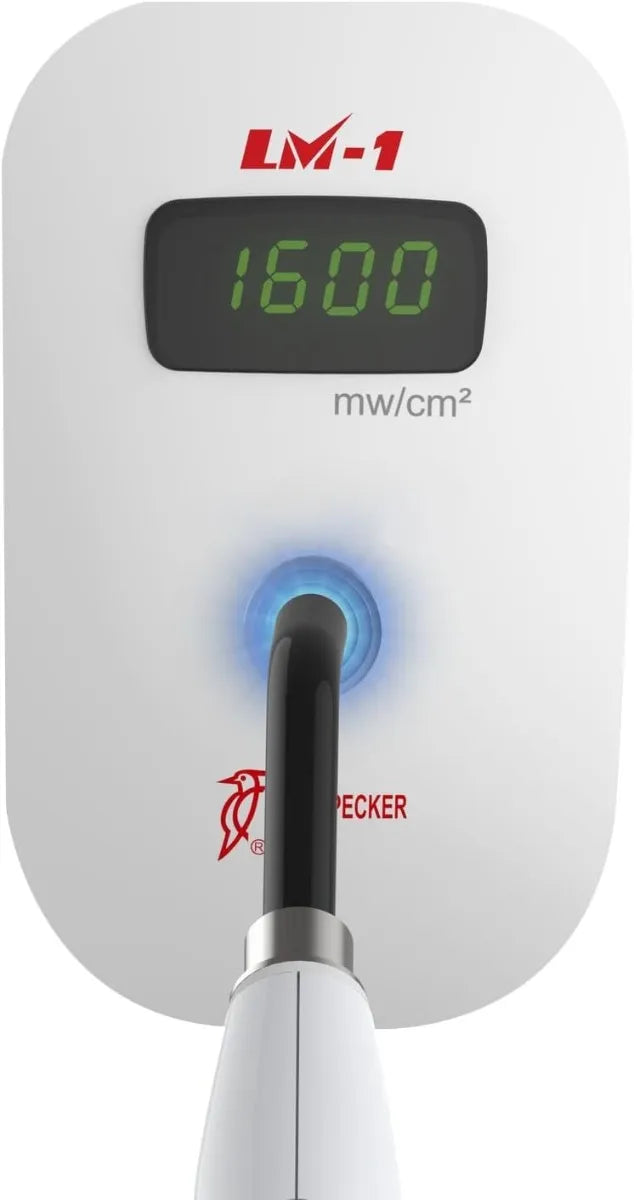 Beetle Dental Woodpecker LED curing light intensity meter LM1 showing 1600 mW per cm2 with probe attached