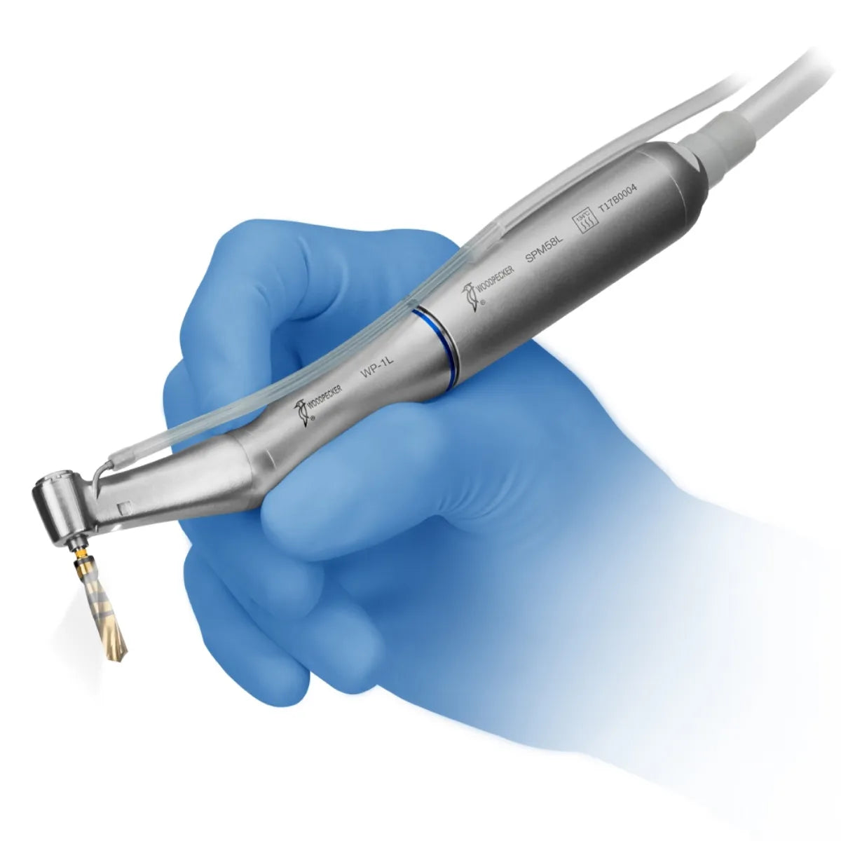 Woodpecker LED implant handpiece stainless steel dental implant drill held in blue gloved hand