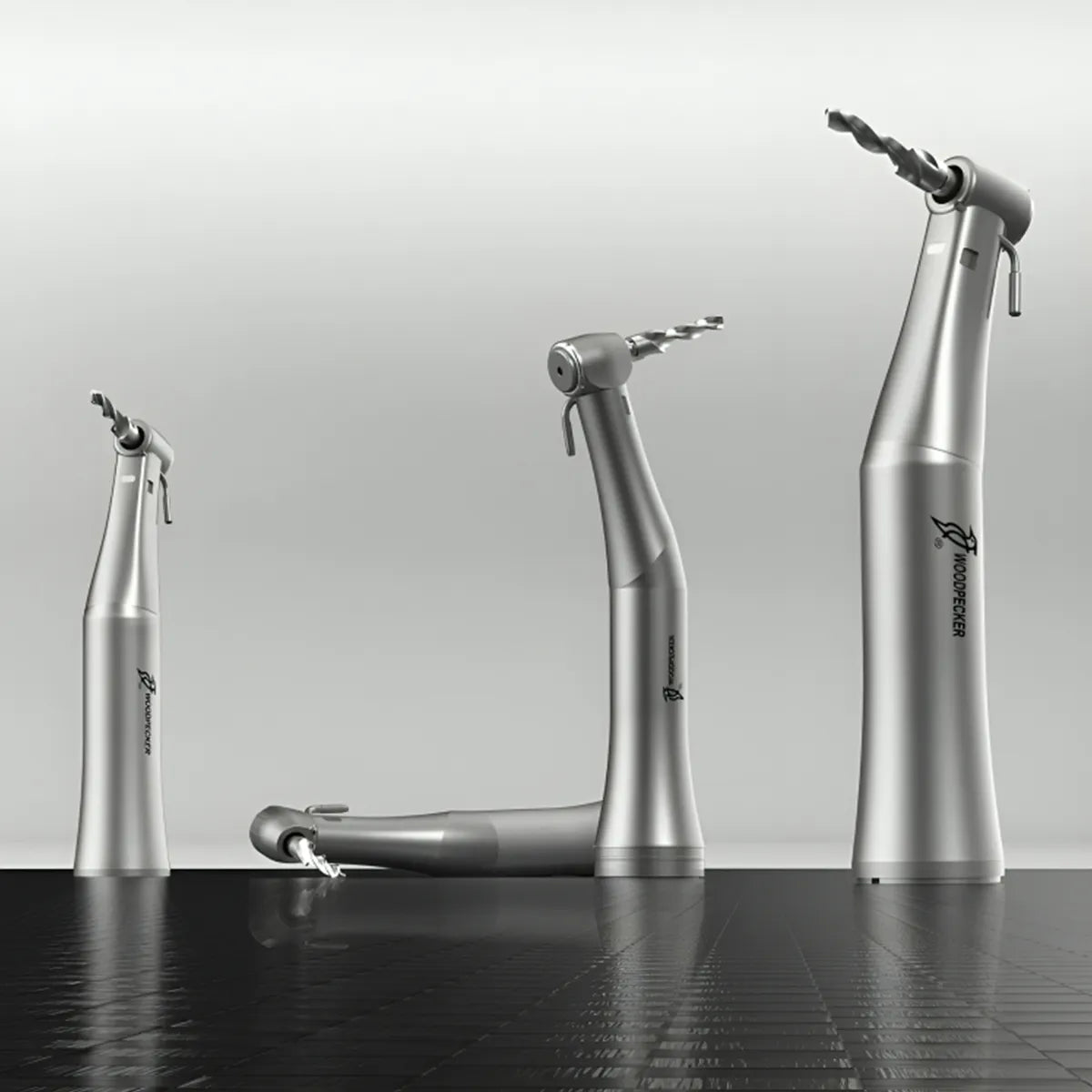 Beetle Dental Woodpecker LED implant handpiece in silver shown from multiple angles with implant drills attached
