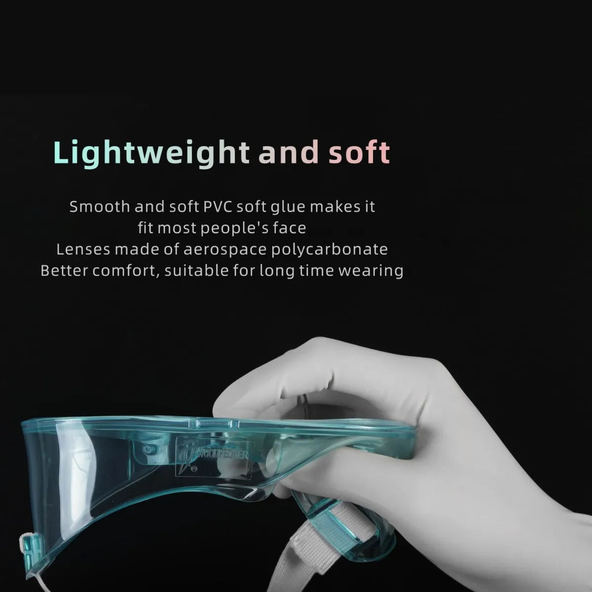 Beetle Dental Woodpecker MG-1 dental goggles translucent teal held by gloved hand highlighting lightweight soft design