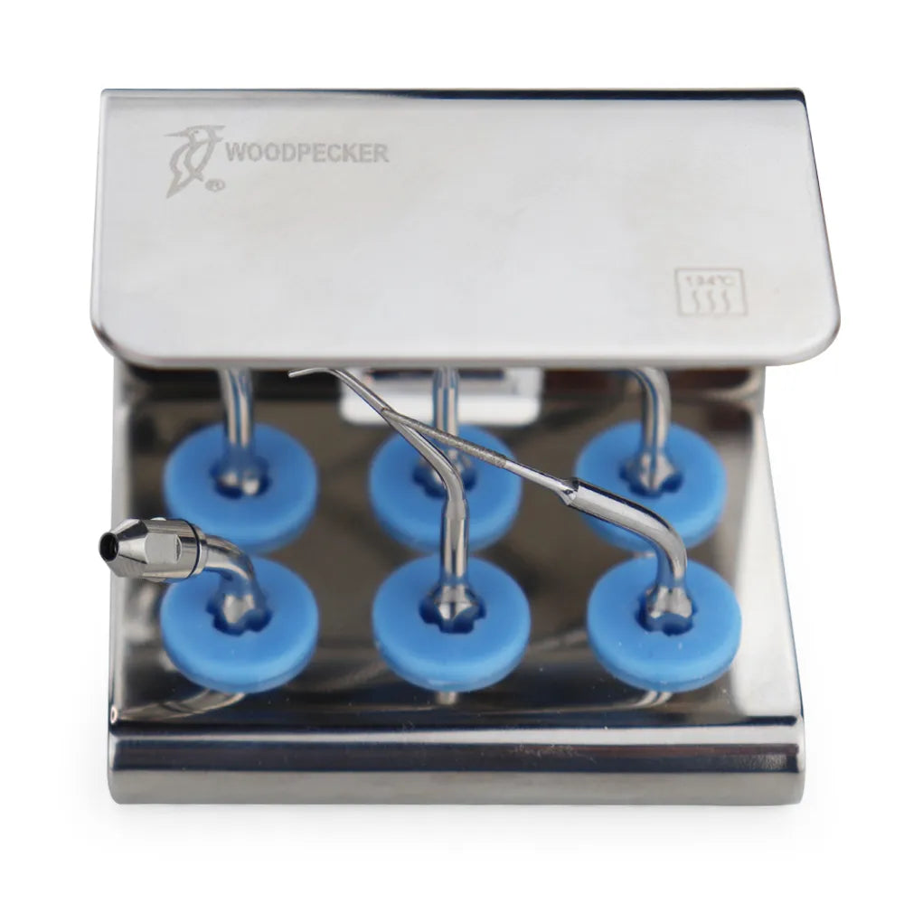 Woodpecker endodontic scaler tips set in stainless steel holder with six blue silicone mounts